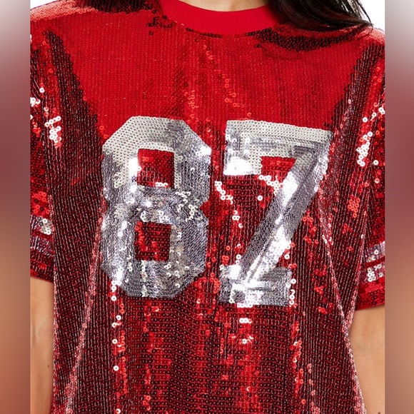 A knit tunic featuring allover sequin embellishments, front number "87" KC - Picture 2 of 6